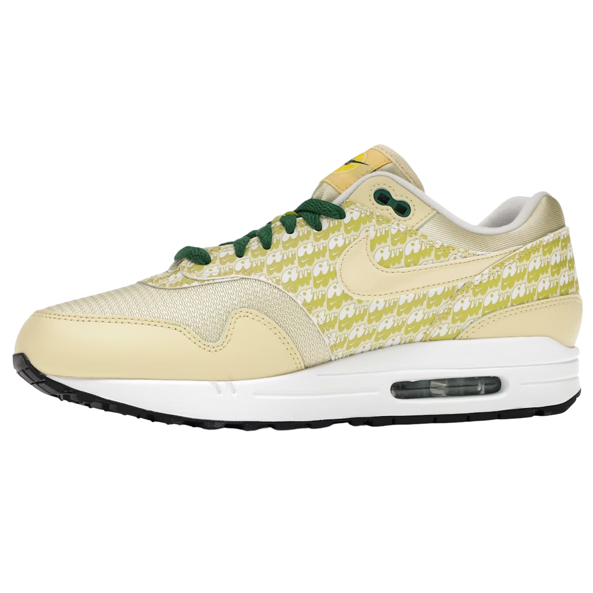 Nike Air Max 1 Lemonade sneakers i profil med limegul overdel i reflekterende materiale, grønne detaljer og en synlig Air-enhed i sålen